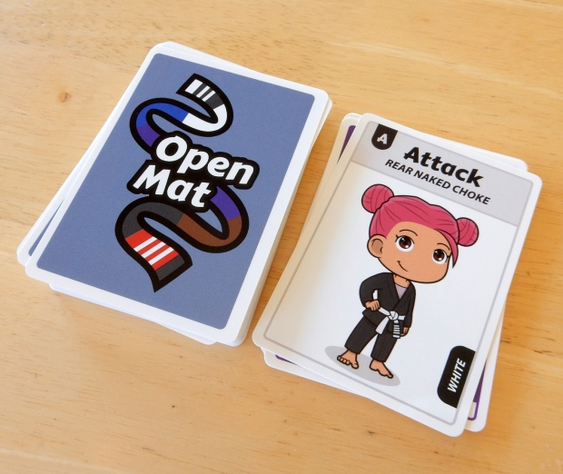 Open Mat card game: card back and card face